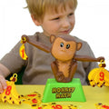 Monkey-themed math board game with brown monkey figure and green base
