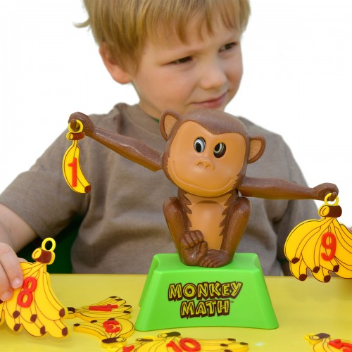 Monkey-themed math board game with brown monkey figure and green base