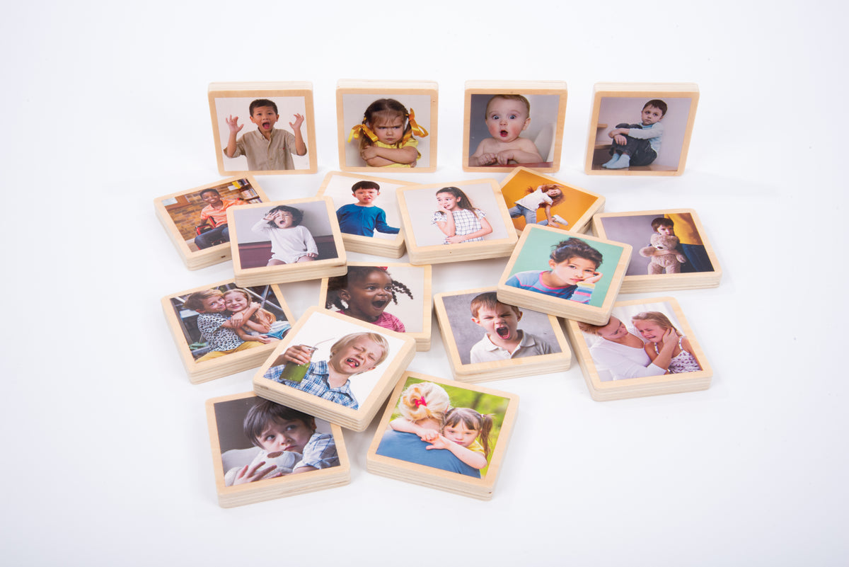 Wooden photo tiles displaying various children portrait photos in square frames