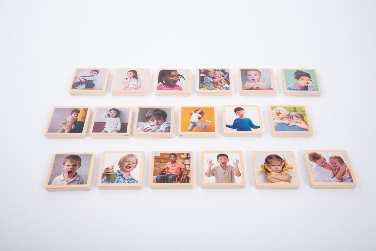 Wooden photo tiles arranged in rows with child portrait photos in square frames