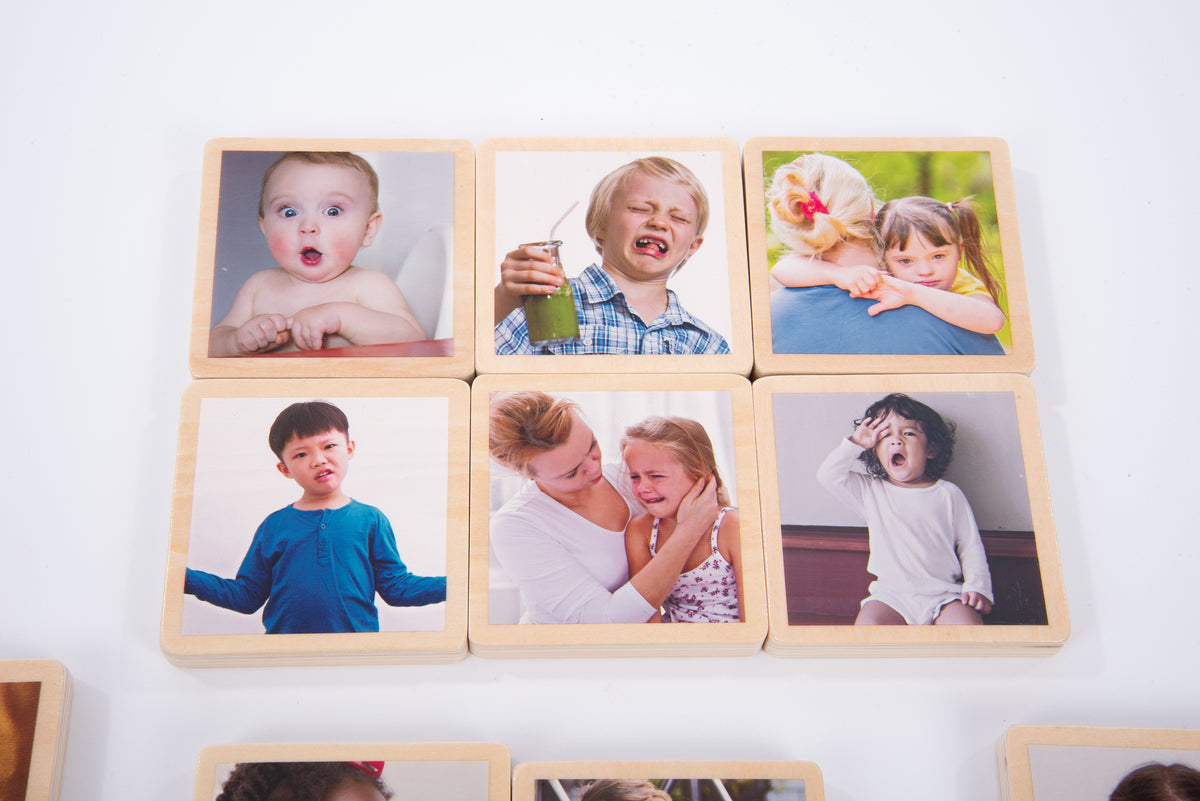 Wooden photo tiles with child portrait photos, shown in a partial grid layout