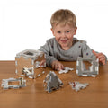 Mirrored construction set, silver geometric panels on a tabletop