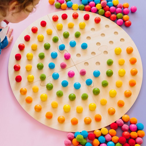 Rainbow globe pegboard toy with colorful plastic balls and a circular wheel