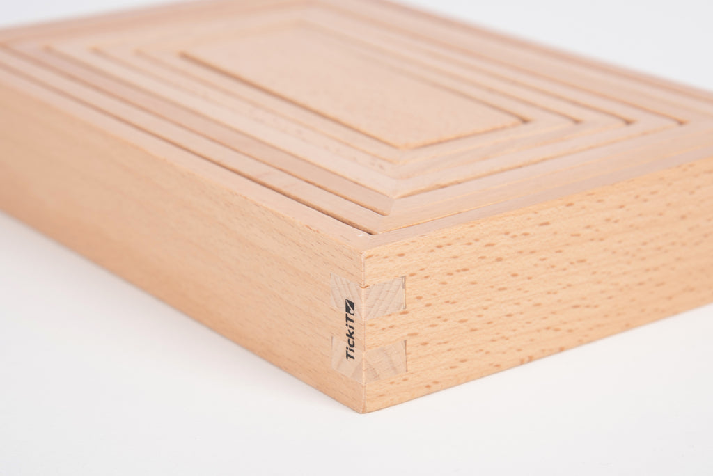 Light wood building block with engraved corner mark and smooth panel grooves
