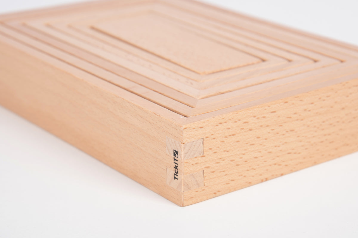 Light wood building block with engraved corner mark and smooth panel grooves