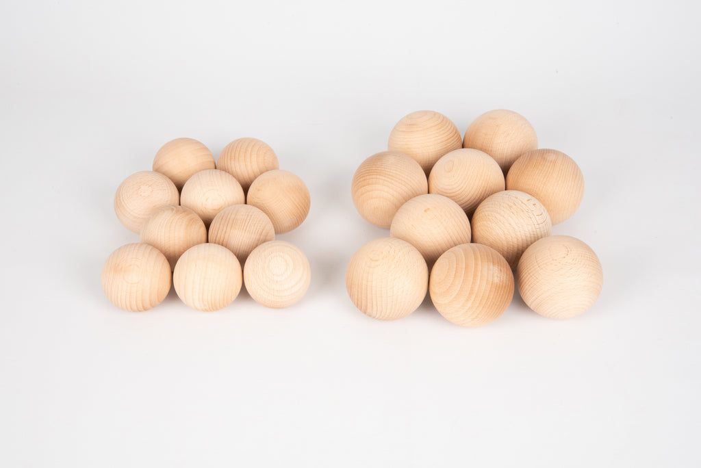 Natural wooden balls, 50mm, small light-wood spheres in two clusters.