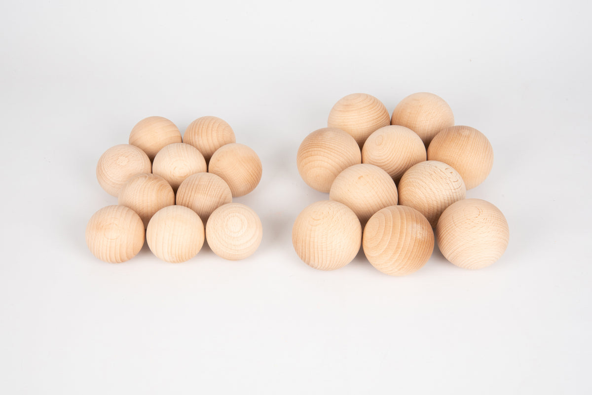 Natural wooden balls, 50mm, small light-wood spheres in two clusters.