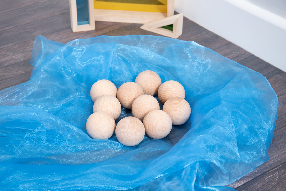 Natural wooden balls, 50mm, light wood spheres inside a blue bag.