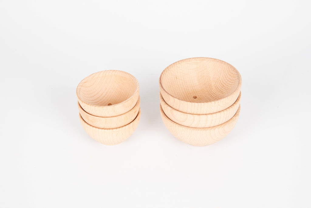 Set of natural wooden bowls with two bowls stacked and two bowls shown