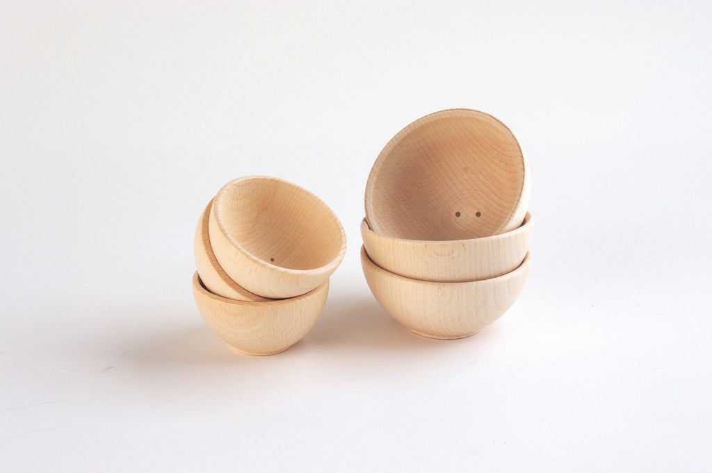 Small natural wooden bowls, two stacks and one standing bowl set