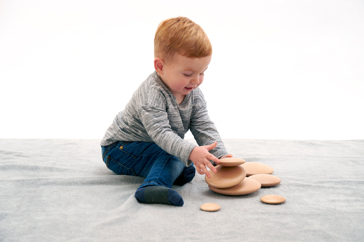 Light tan natural wooden buttons set of 7, round discs on fabric