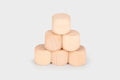 Natural light wood cube blocks, stacked in a small pyramid shape
