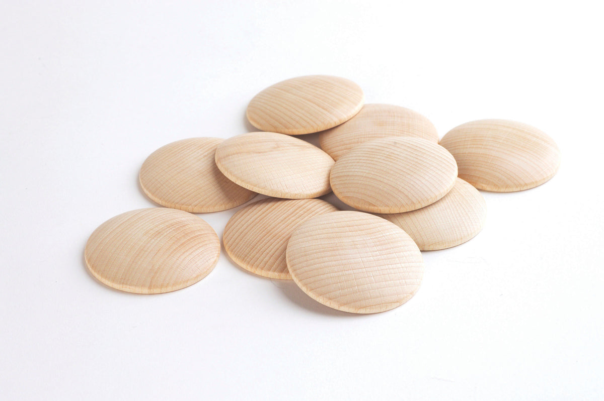 Natural wooden discs, light tan oval slices with fine parallel grain grooves