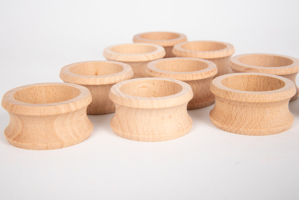 Natural wooden napkin rings, nine round carved holders with ridged sides