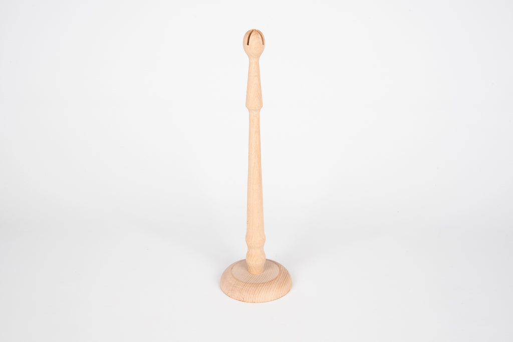 Natural wooden ring stand with round base and upright peg for displaying rings