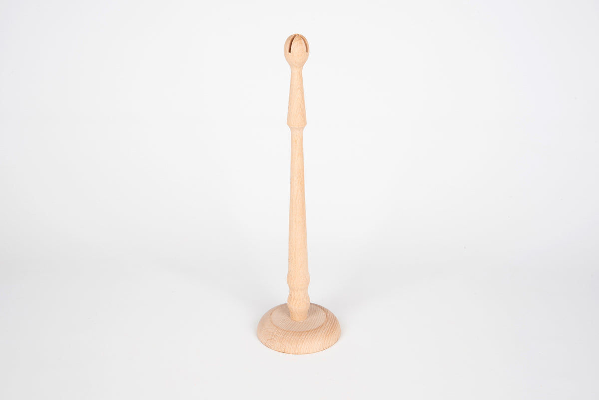 Natural wooden ring stand with round base and upright peg for displaying rings