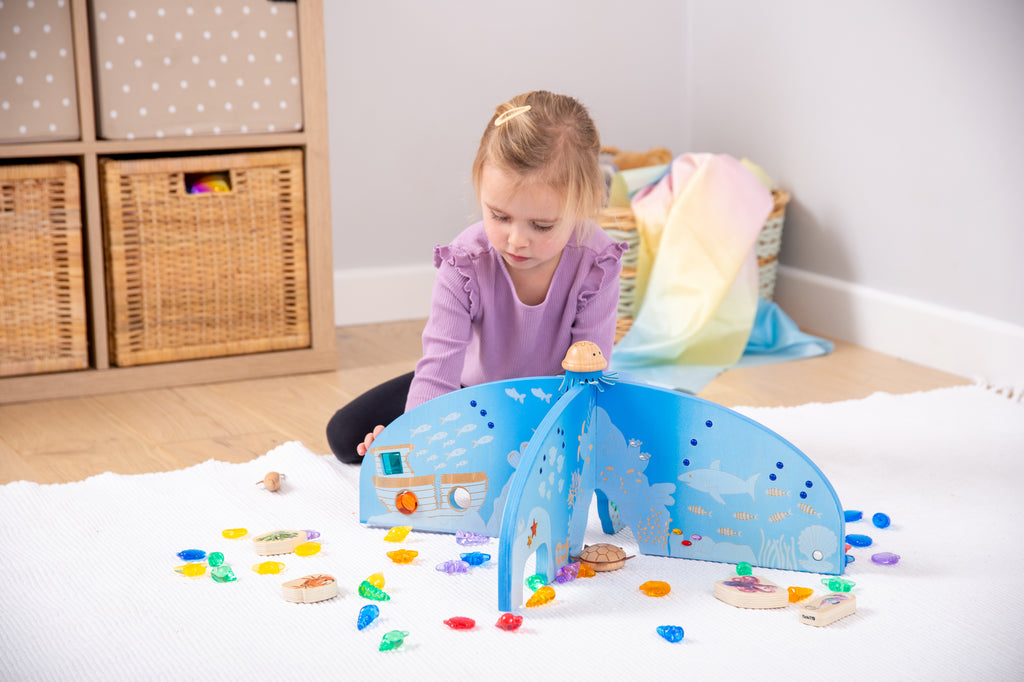 Blue ocean play divider screen with front arch and cutout wave shapes
