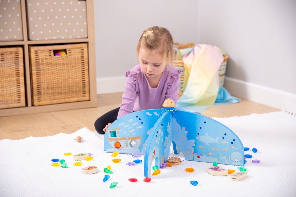 Blue ocean play divider screen with front arch and cutout wave shapes