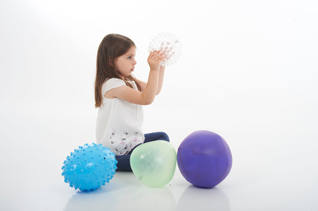 Sensory ball set with blue spiky and white speckled balls, green and purple smooth balls