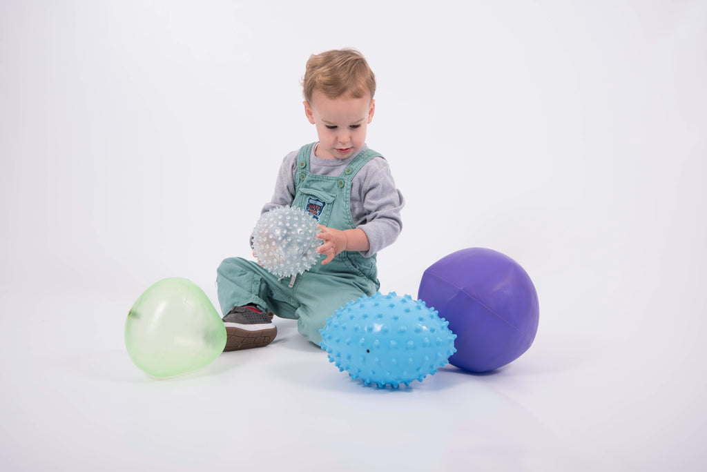 Sensory ball set for kids: blue spiky, white speckled, green and purple smooth balls
