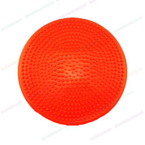 Gymnic balance wobble cushion with orange studded surface