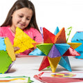 Colorful geometric construction set with polygon pieces for building star shapes