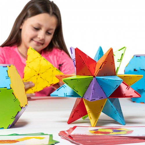 Colorful geometric construction set with polygon pieces for building star shapes
