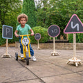 Set of outdoor wooden road signs: triangle 5, circle 30, stop, parking P