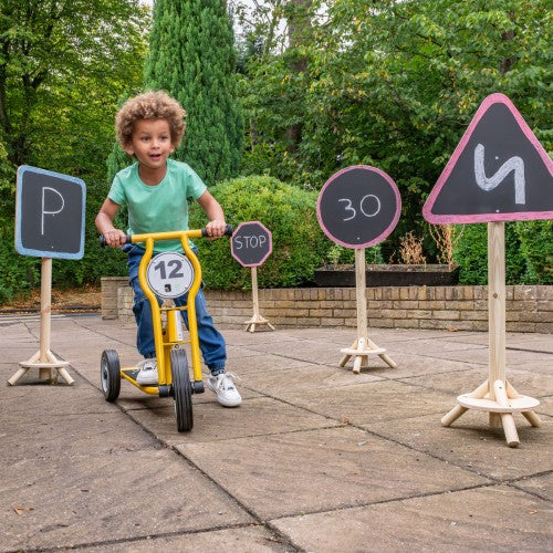 Set of outdoor wooden road signs: triangle 5, circle 30, stop, parking P