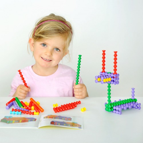 Colorful bead stacking rod set with pieces, child holding rods at table