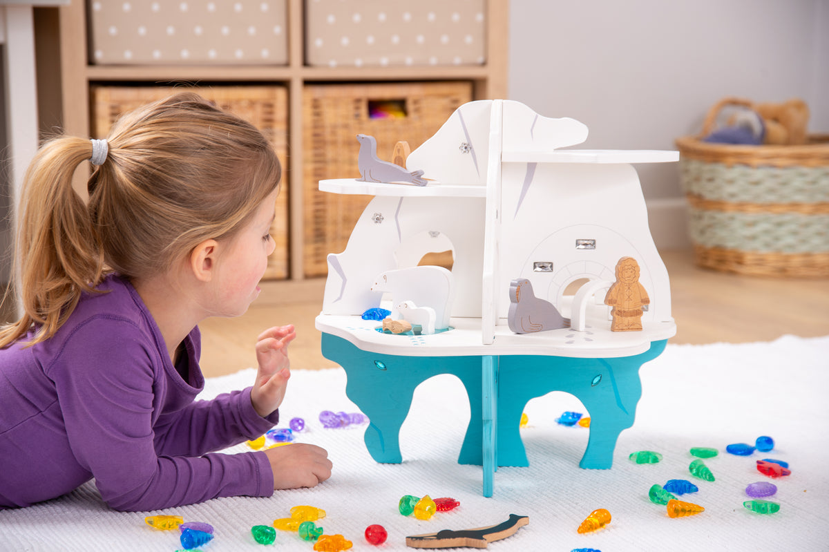 White and blue toy boat playset on blue legs with open side compartments
