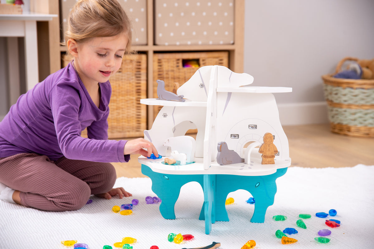 White and blue playset boat with cockpit window and colorful small parts