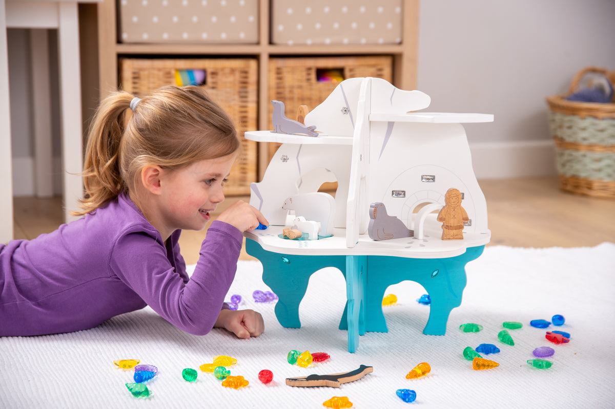 White and blue toy boat playset with front doorway and side control details