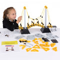 Yellow and black bridge construction set with arched frame pieces and instruction guides