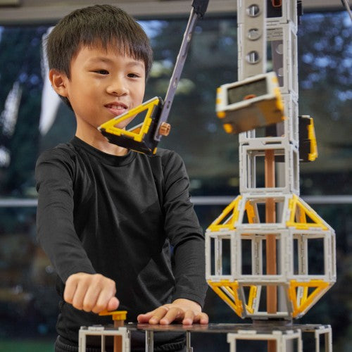 Plastic engineering construction pieces with yellow connectors and rectangular frames