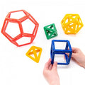Plastic Platonic solids framework set of colorful interlocking polygon frames, held in hand