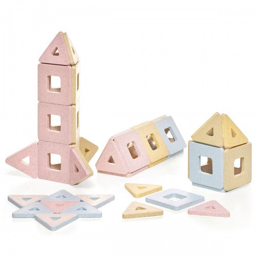 Magnetic building tiles set with pastel house blocks, triangles, and flat pieces