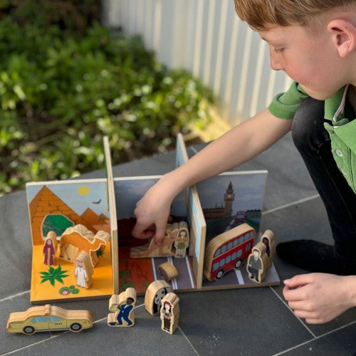 Wooden play set with castle and bus pieces and small figurines, for pretend play