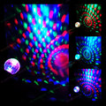 Light-up projector globe wand casting multicolor spiral and dot light patterns