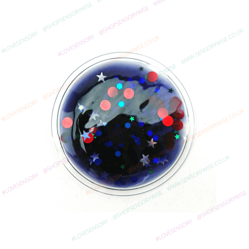 Sensory glitter disc with domed clear top, deep blue base with red, teal, and silver sparkles