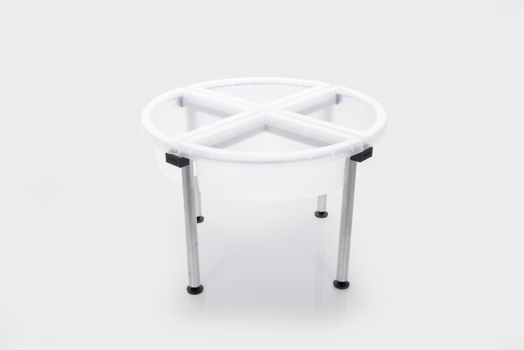 Four-compartment clear plastic tray on metal stand