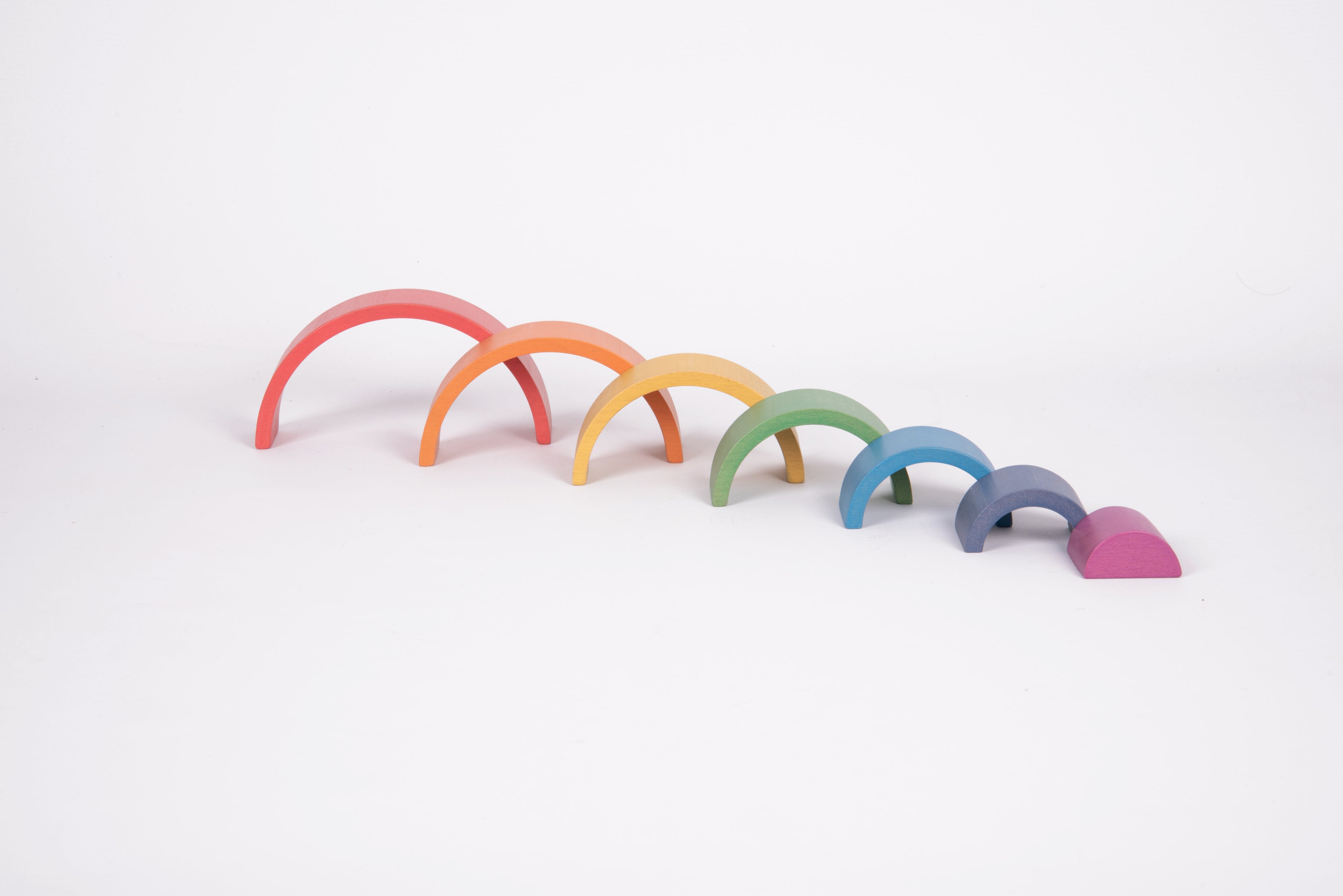 Rainbow arch toy set with multiple curved arches in red to purple and dark base pieces