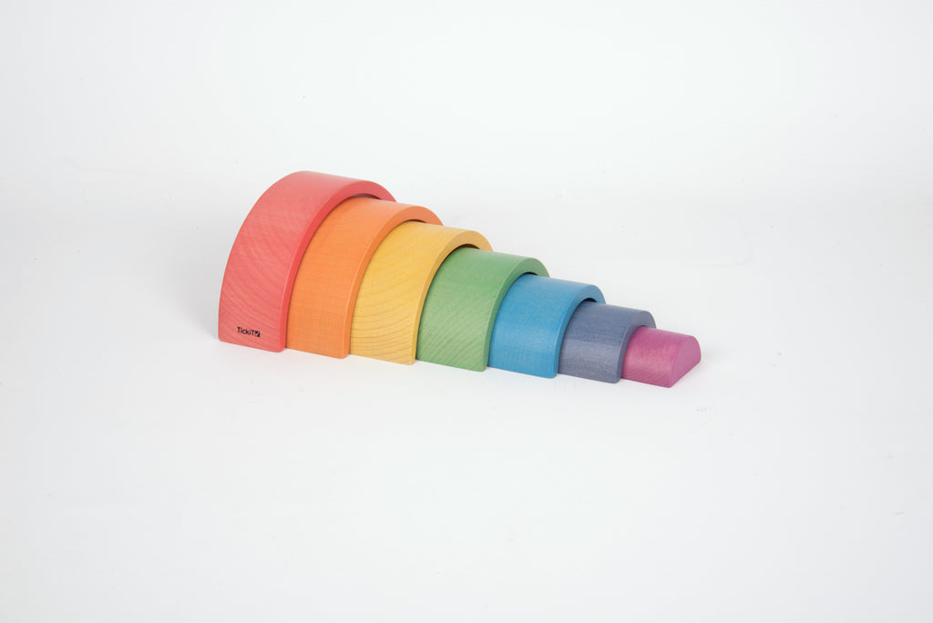 Rainbow arch toy with five layered curved arches in coral, orange, yellow, green, blue, purple