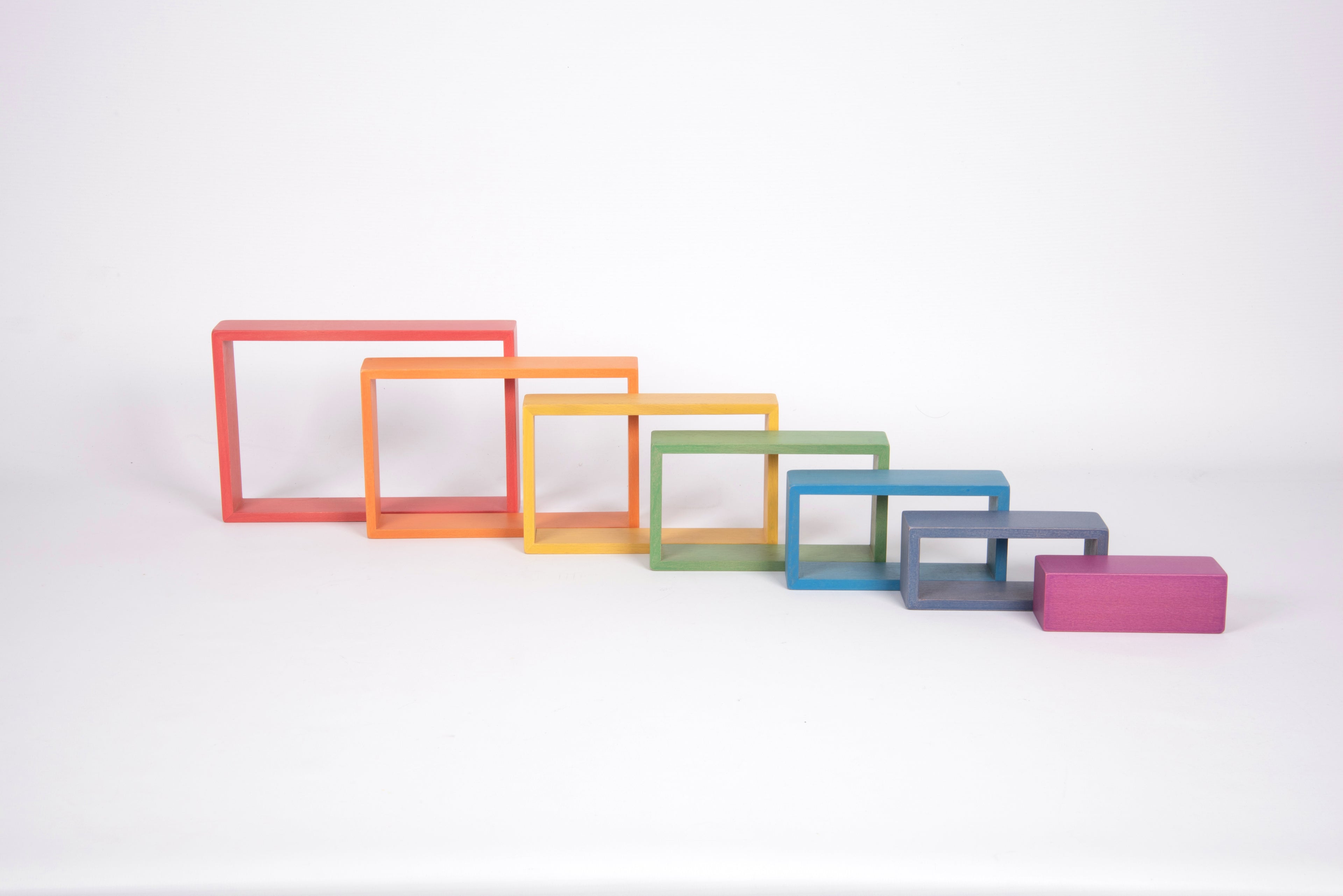 Assorted colorful rectangular frame blocks with stacked frames and a small pink piece