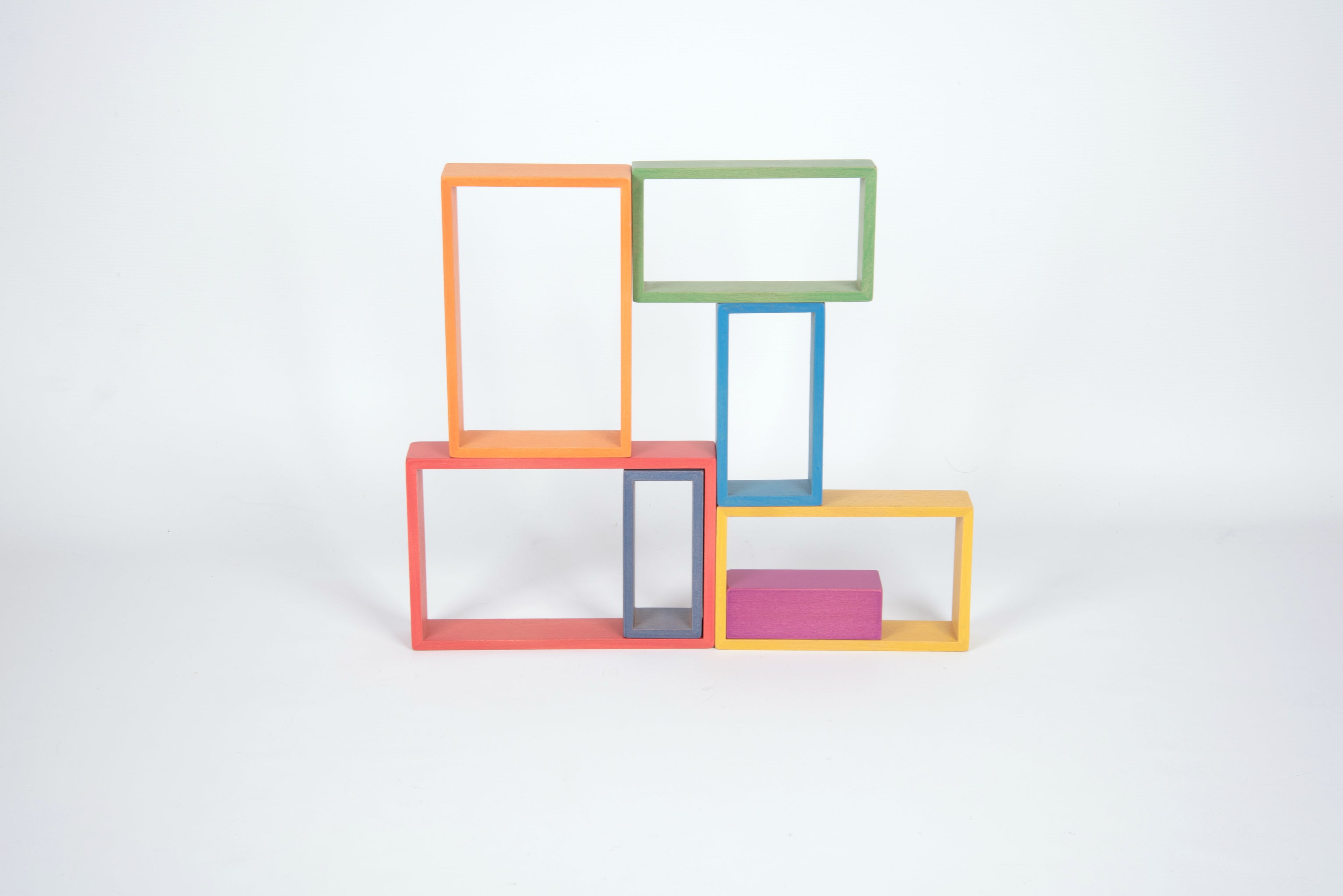 Cluster of colorful rectangular frame blocks with open centers and a pink base