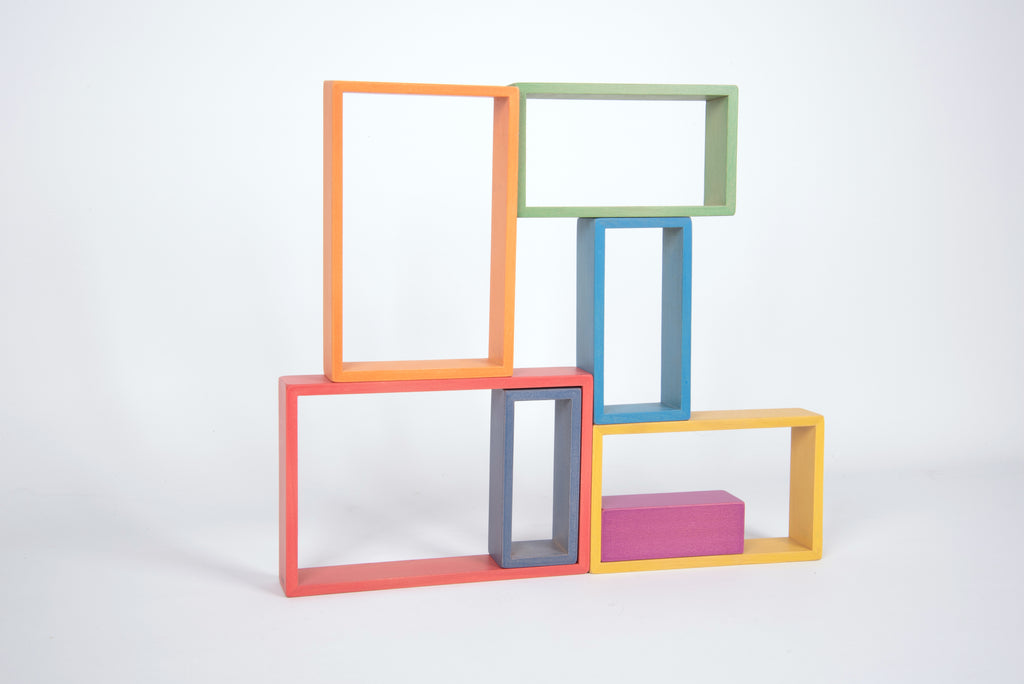 Stacked colorful rectangular frame blocks with open centers and a yellow base
