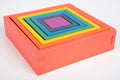 Rainbow nested square and rectangle foam panels on pink base