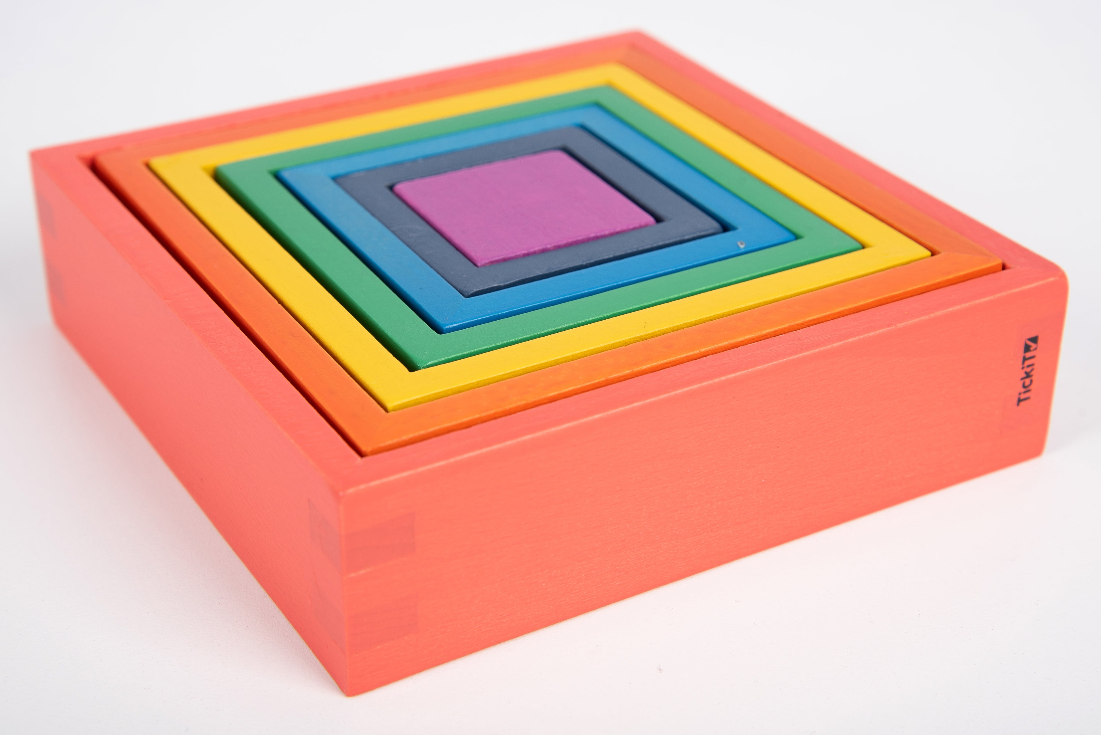 Rainbow nested square and rectangle foam panels on pink base