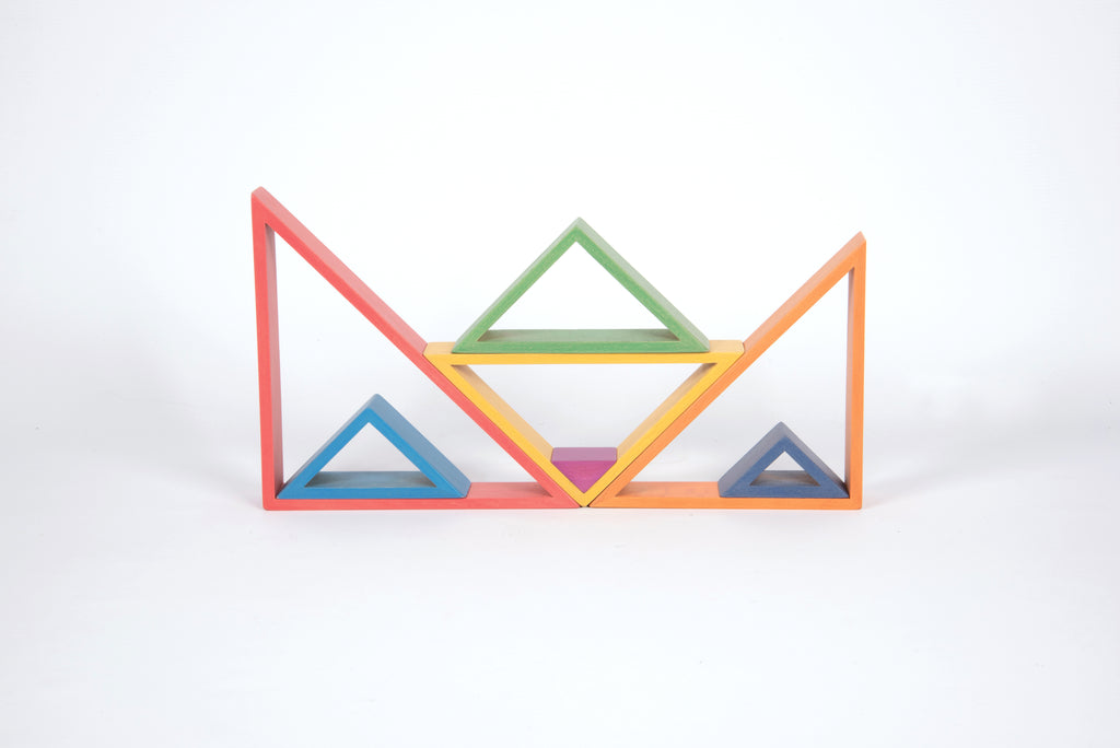 Triangle frame blocks with layered colors, side-by-side openings in red, green, and blue.