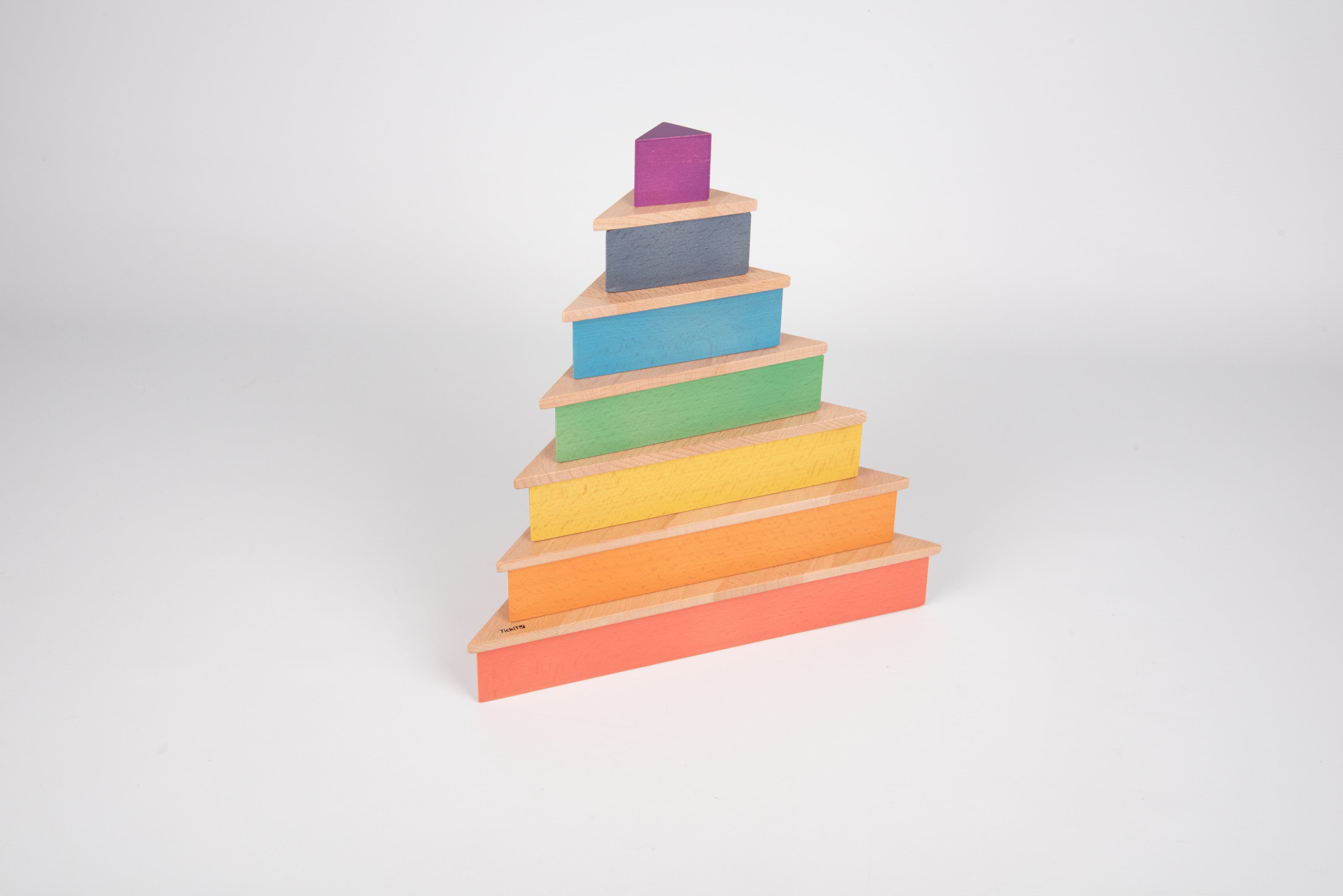 Rainbow triangle stacking blocks, angled stack with small purple top piece.